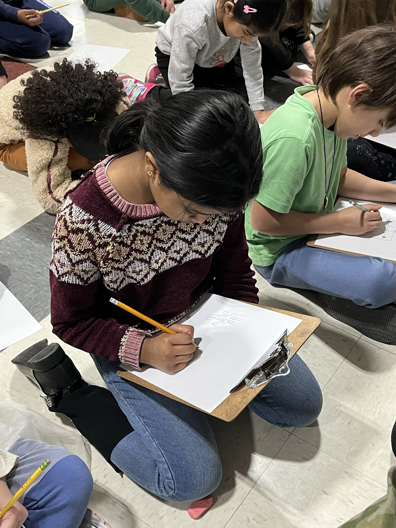 IMG_1855 Students at Harrington Elementary School create drawings during an assembly with artist Bren Bataclan on Monday, March 16, 2026.