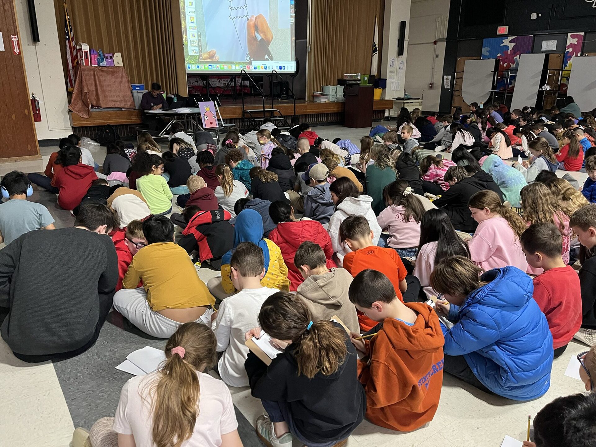 IMG_1892 Students at Harrington Elementary School create drawings during an assembly with artist Bren Bataclan on Monday, March 16, 2026.