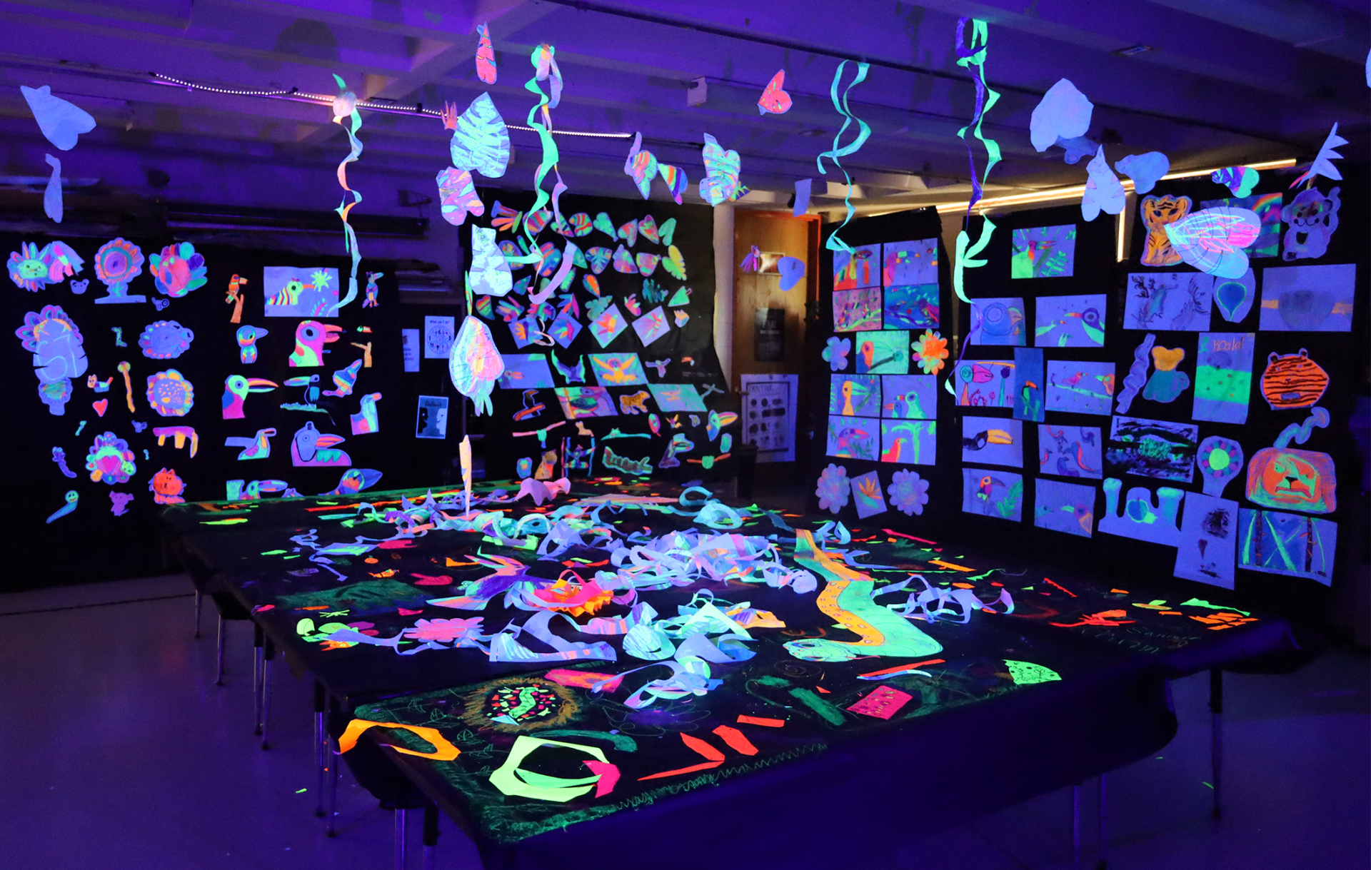 The art room at Harrington Elementary School was transformed into a glow-in-the-dark rainforest during the Celebration of the Arts event on Wednesday, May 22, 2026.