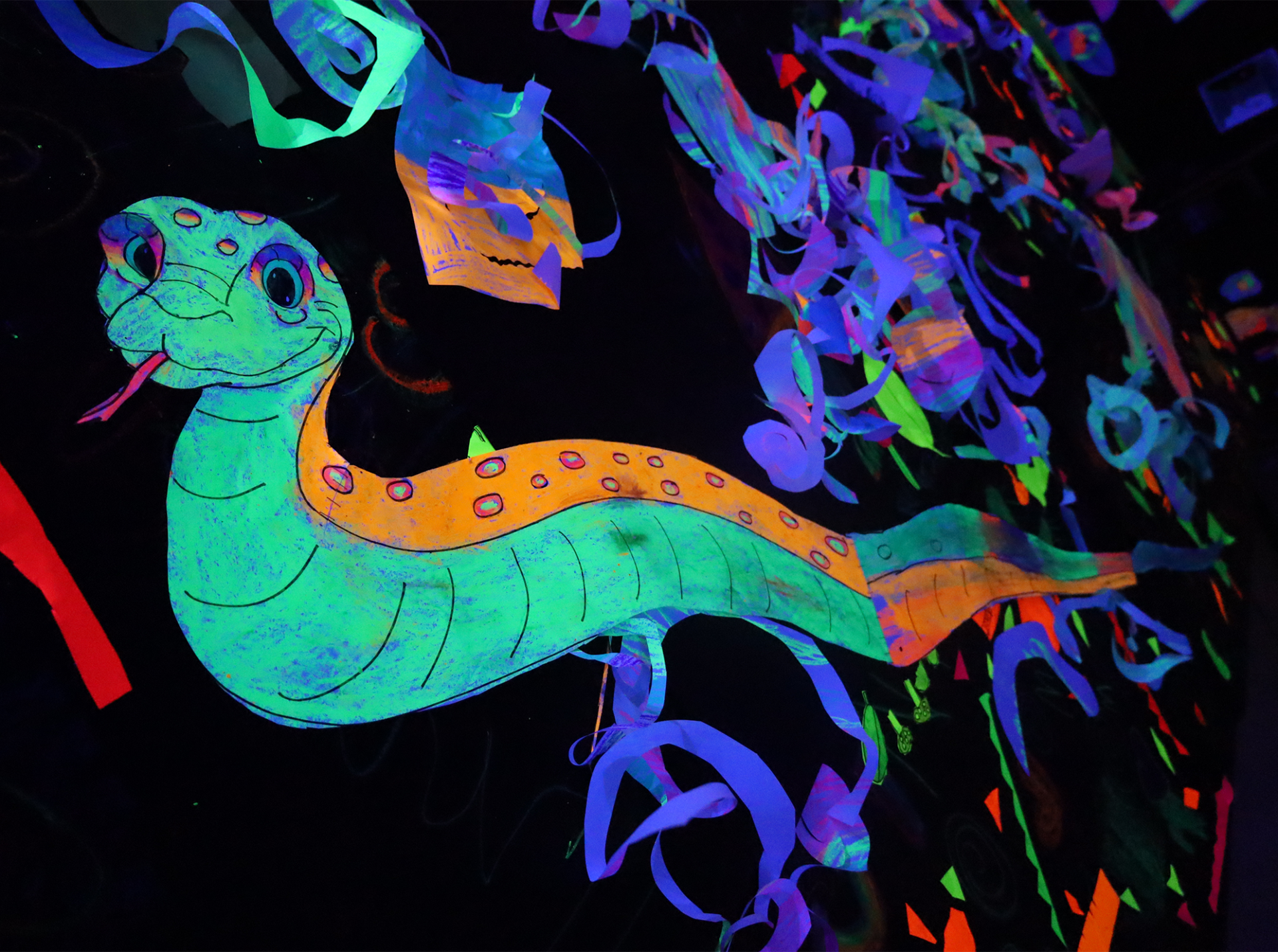 The art room at Harrington Elementary School was transformed into a glow-in-the-dark rainforest during the Celebration of the Arts event on Wednesday, May 22, 2026.