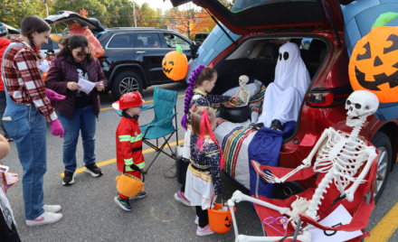 Harrington Elementary School students and their families enjoy trunk-or-treating in the parking lot on Saturday, October 17, 2026.
